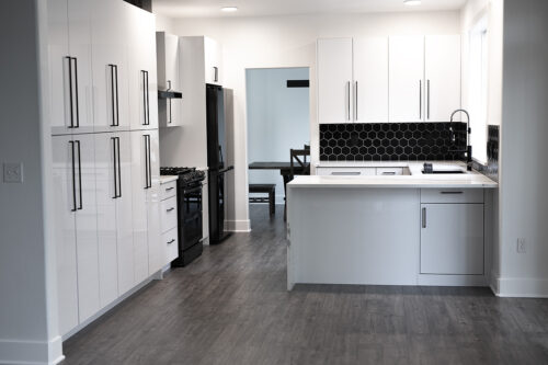 Black Backsplash with White Cabinets