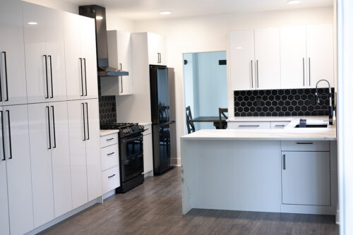 Black Backsplash with White Cabinets