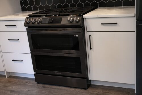 Black Backsplash with White Cabinets