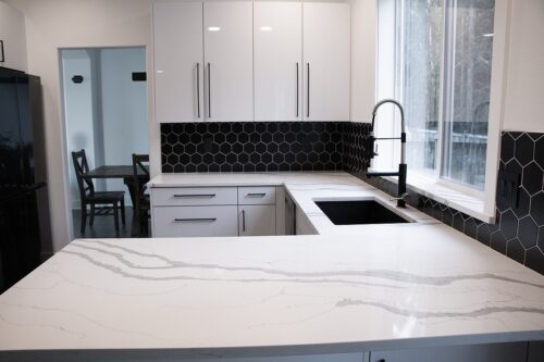 Black Backsplash with White Cabinets